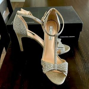 INC size 8 1/2 gold with rhinestones.